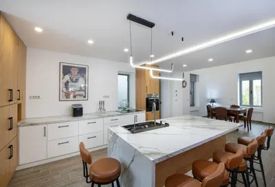 a kitchen with a large island in the middle at Chania Luxury City Retreat , Hammam & outdoor Jacuzzi in Chania Town