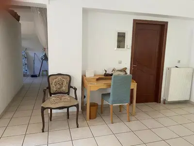a dining room with a table and two chairs at Ellie's Kantanos in Kántanos