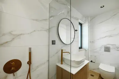 a white bathroom with a sink and a mirror at Madre Tierra Boutique Villas 3 & 4 in Potistíria