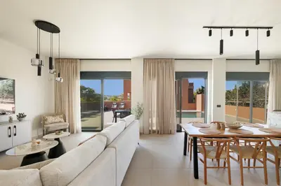 a living room with a couch and a table at Madre Tierra Boutique Villas 3 & 4 in Potistíria