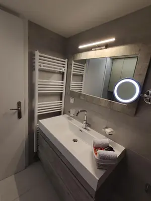 a bathroom with a sink and a mirror at Downtown house with seaview near to the beach in Chania Town