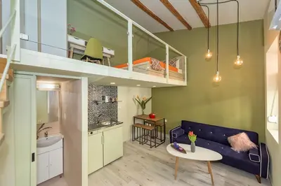 a living room with a couch and a bunk bed at Rea Studio 2 in Chania Town