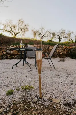 a table and a table and a table and a table and chair at Olive Dome, Luxury Glamping Dome in Crete in Gavalochori