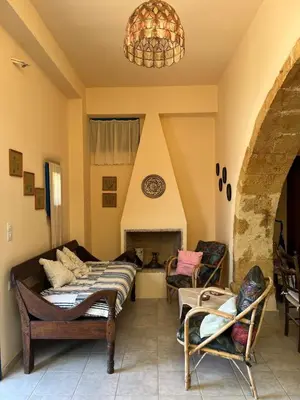 a living room with two beds and a fireplace at Casa Antica