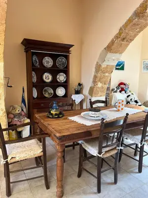 a dining room with a wooden table and chairs at Casa Antica