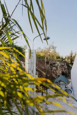 a street light in front of a fence at Lemon Dome, Luxury Glamping Dome in Crete in Gavalochori