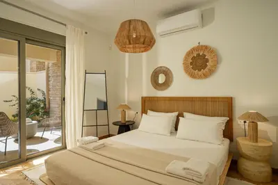 a bedroom with a large bed and a balcony at Ocean Bay Sea View Apartment, Pool, Brand New, 2B in Kalyves