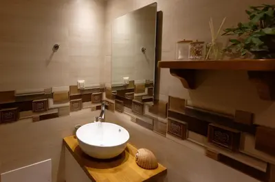 a bathroom with a bowl sink and a mirror at Vecia Abasia - The Old Abbey in Chania Town