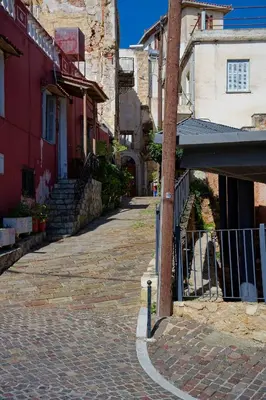a cobblestone street in a town with buildings at Vecia Abasia - The Old Abbey in Chania Town