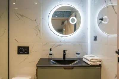 a bathroom with a sink and a mirror at Armdin Seaview Villa 3 in Módhion
