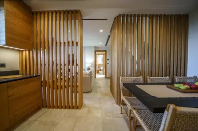 a kitchen and dining room with a table and chairs at EAST VILLA by CYAMES in Gavalochori