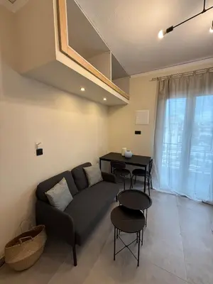 a living room with a couch and a table at NESTIVA - Apartment in the Center of Chania in Chania Town