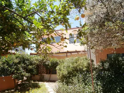 a house with a garden in front of it at Glaros Home in Kato Daratso