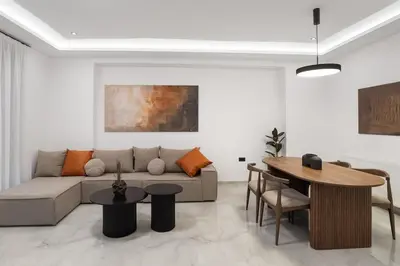 a living room with a couch and a table at Elan Stay in Chania Town