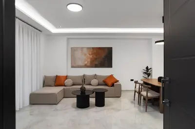 a living room with a couch and a table at Elan Stay in Chania Town
