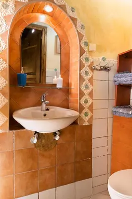 a bathroom with a sink and a mirror at Villa Margot in Chania Town