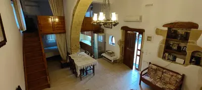 an overhead view of a room with a table and a bedroom at Filippou Villa - Living in Nature in Fílippos