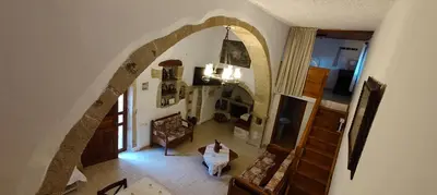 an overhead view of a living room with an archway at Filippou Villa - Living in Nature in Fílippos