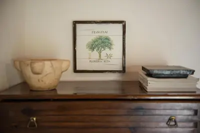 a picture of a tree on top of a dresser at Petra & Elia in Megála Khoráfia