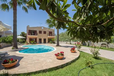 a villa with a swimming pool and a house at Erodios Villas 1 in Gerani Chanion