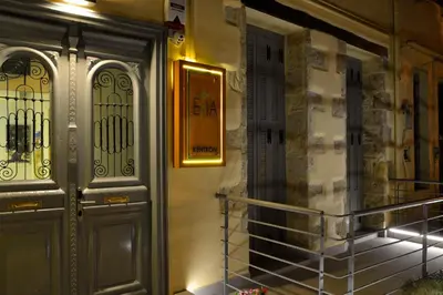 a door to a building with a sign on it at Elia Kentron in Chania Town
