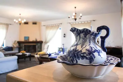 a blue and white vase sitting on top of a table at Mantilida Villa & Studio in Kissamos