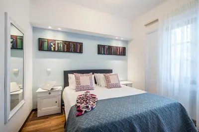a bedroom with a bed and a sink in it at Villa Oleander in Kounoupidhianá