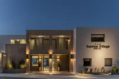 a building with the entrance to the sunshine village hotel at Sunrise Village Hotel - All Inclusive in Plataniás