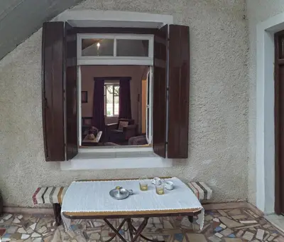 a table in front of a mirror on a wall at Venezian Castle House in Kissamos