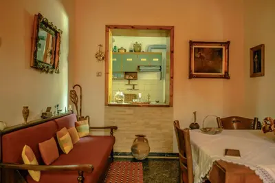 a living room with a bed and a window at Venezian Castle House in Kissamos
