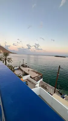a view of the ocean from the roof of a building at Scirocco Rooms in Loutro