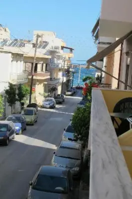 a street with cars parked on the side of the road at Constantinos Studios in Chania Town