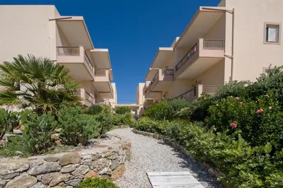 a walkway in front of a building at Joanna's Place in Palaiochóra