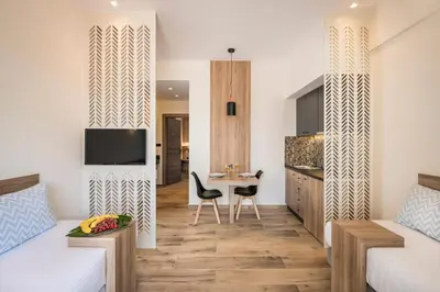 a living room with a bed and a dining room at Sea & City Apartments in Chania Town