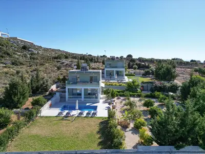 an aerial view of a large white house at Κatakis Villas in Agios Onoufrios
