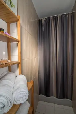 a shower with a black curtain in a bathroom at Dekem Residence in Gavalochori