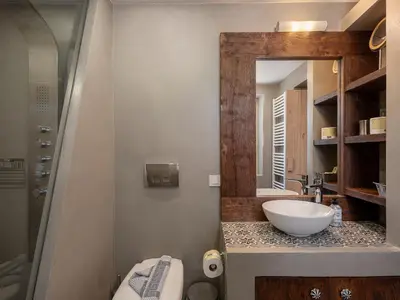 a bathroom with a sink and a mirror at Geraniotis Villa in Gerani Chanion