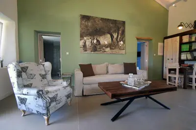 a living room with a couch and a coffee table at Geraniotis Villa in Gerani Chanion