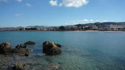 a large body of water with rocks in the water at Hostel Stylianos Kissamos in Kissamos