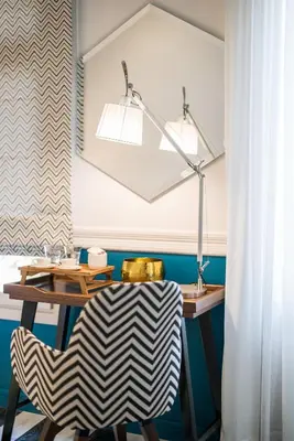 a dining room with a table and a lamp at Elia Portou Due in Chania Town