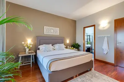 a bedroom with a bed in a room at Villa Ampelaki - Premium Villa with heated pool in Kounoupidhianá