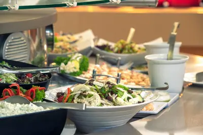 a buffet of different types of food on a table at Iolida Beach by Smile Hotels in Agia Marina Nea Kydonias