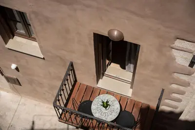 an overhead view of a wooden staircase with a clock on it at Casa Regina Luxury House in Chania Town