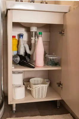 a kitchen cabinet with bottles and utensils at Plakoures Home in Kounoupidhianá