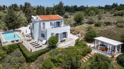 an aerial view of a house with a swimming pool at Villa di Lusso Agave con Piscina Privata Riscaldata e Jacuzzi in Litsárdha
