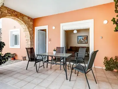 a dining room with a table and chairs at Villa in Kalamitsi near White Mountains in Kalamítsion Alexándrou