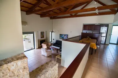 a living room with a table and a couch at Ktima Nikolaos in Arónion