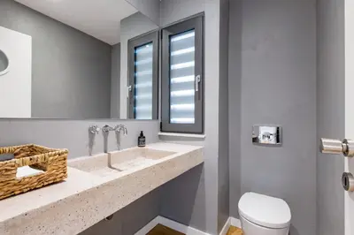 a bathroom with a sink and a toilet and a window at Happy Villa in Kato Galatas