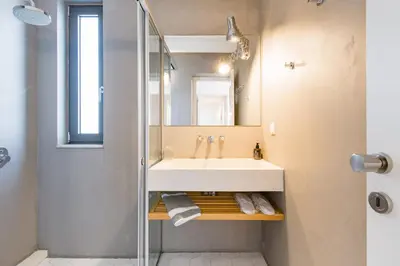 a bathroom with a sink and a mirror at Happy Villa in Kato Galatas