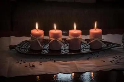 a group of candles on a plate on a table at Villa Fabrica in Thimiá